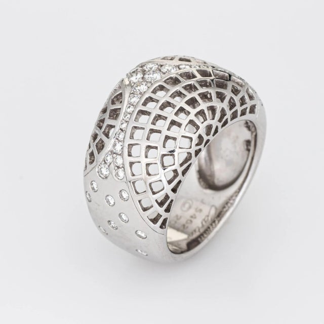 Stylish vintage Cariter ''Nouvelle Vague'' diamond ring crafted in 18 karat white gold (circa 2000). Round brilliant cut...