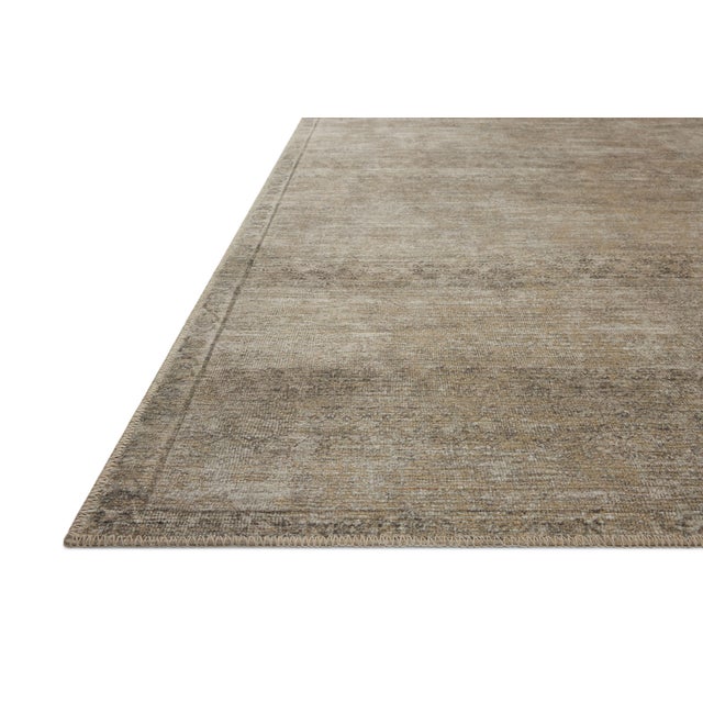 The Cambria Collection is a beautifully executed vintage-style area rug from Amber Lewis x Loloi with a blended jute and...
