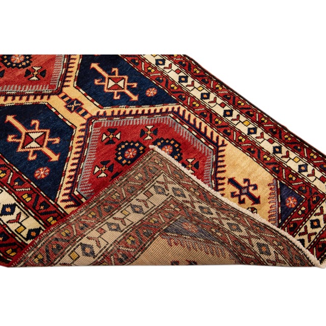 Beautiful Antique Persian Shiraz Handmade Wool rug with an all-over navy blue field. This piece has multi-color accents in...