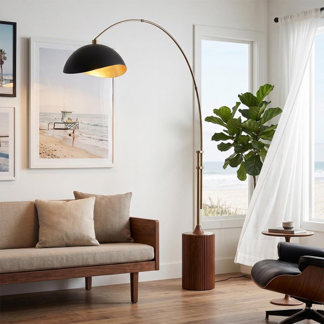 The Tambo Arc Lamp is a dimmable mid-century modern lighting piece designed by Peter Morelli in 1984. This elegant arc...