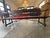 This piece is an Antique Spanish Renaissance Revival Carved Wood Hall Bench, dating from the 1920s. It is crafted from...