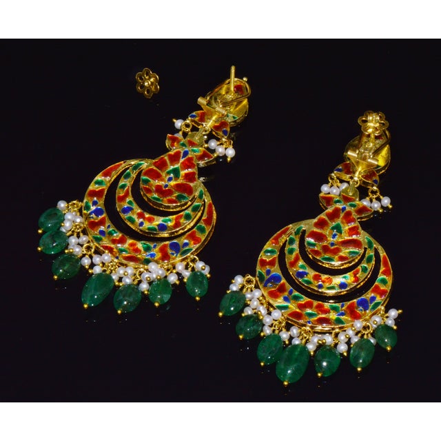 Authentic natural Polki diamond and emerald chandelier earrings handcrafted in solid 22K and 18K gold. These exceptional...