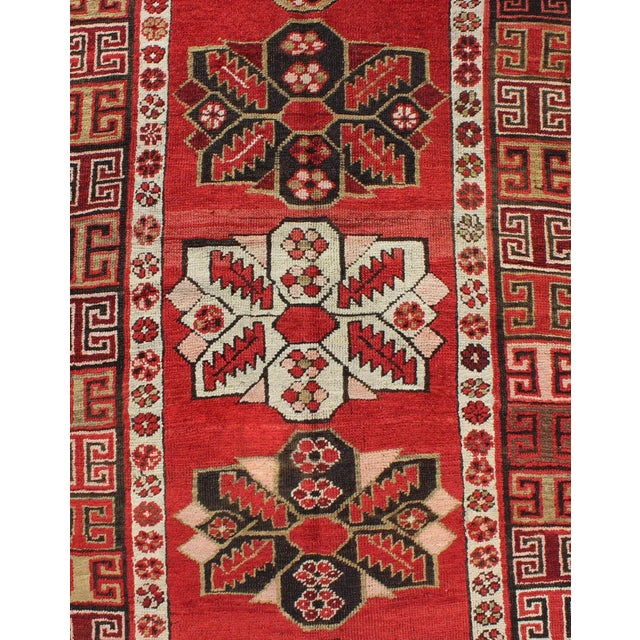 1900 - 1909 Antique Kazak Runner With Seven Medallions and Tribal Design in Red Background For Sale - Image 5 of 8