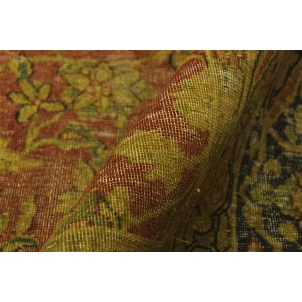 A mesmerizing addition to any décor, this brand-new hand knotted vintage distressed wool rug featuring vibrant colors and...