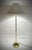 Bring timeless Mid-Century Modern style into your home with this beautiful vintage floor lamp, attributed to Laurel...