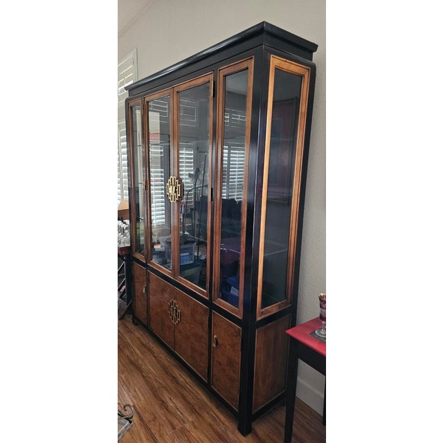 Beautiful high quality hardwood Burl wood with black Asian inspired frame. I have a dining table, 6 chairs, and buffet all...