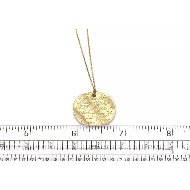 27290 - Tiffany & Co. Notes 18k Yellow Gold Round Wave