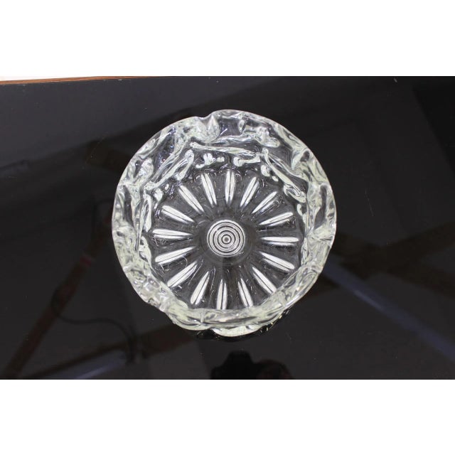 This ashtray is made of pure metallurgical glass. It was made in Nový Bor in Czechoslovakia.