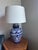Large, hand-painted Mexican ginger jar or amphora shaped table lamp. A blue and white glaze of floral and leaf patterns....