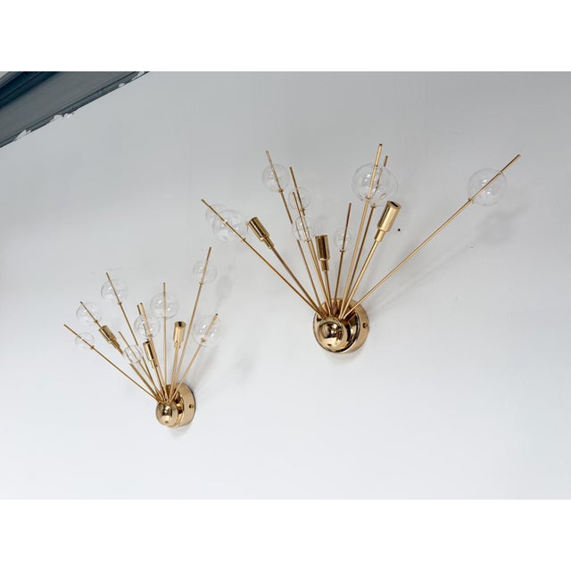 A unique set of 2 glamorous lamps of Italian origin, dating from the 1970s! The lamps feature a gold-plated metal base...