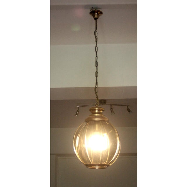 Brass chandelier with smoked glass segments, second half of the 20th century. In good condition, with a beautiful patina...