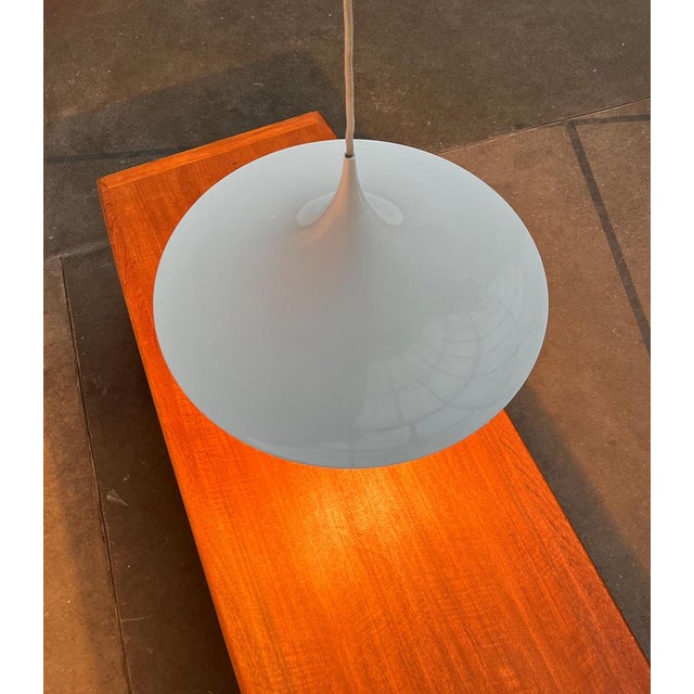 Semi pendant light from the Italian manufacturer Egoluce. Elegant shape, narrow in profile. The entire shape of the...