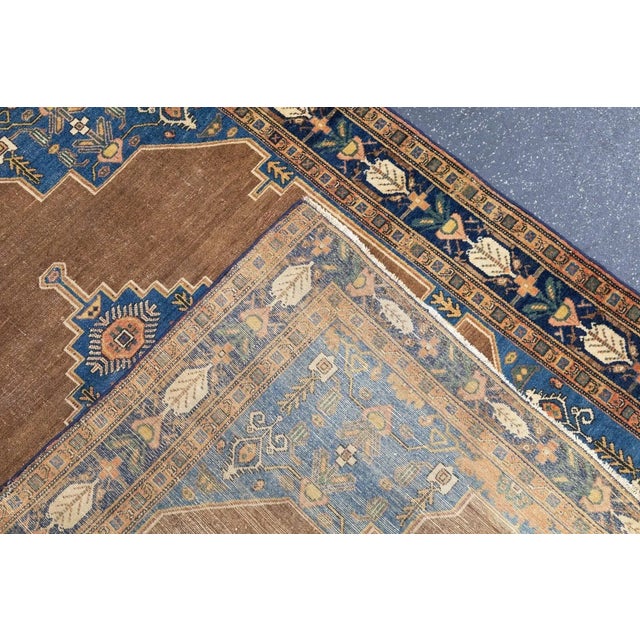 The field is actually medium blue, attenuating along the sides and opening into broadly stepped corner pieces with...