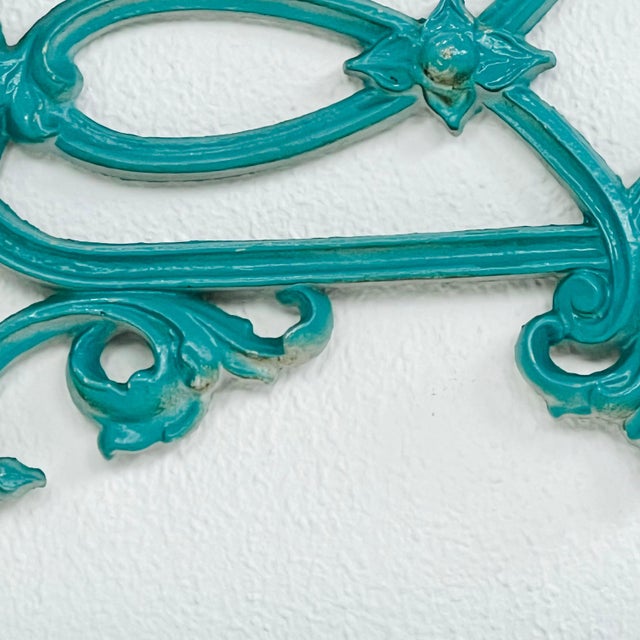 Pair of chic twin size wrought iron headboards with Greek key and fleur de lis design. Bolts to standard metal bedframe....