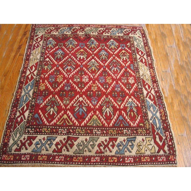 Antique Kurdish rug. Size: 3'6" x 4'6". Antique Kurdish Persian Coral 1900s Rug, Circa Date: 1900s. This compelling piece...