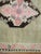 A very unique Turkish Kars rug with four striking medallions in brown and pink surrounded by a wavy pink motif border....