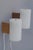 An elegant and increasingly rare pair of model 720 wall lights, designed by uno & östen kristiansson and produced by luxus...