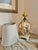 Bring a classic coastal elegance to your space with this beautiful glass shell filled table lamp. Measures 14 inches to...