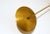 This elegant and refined gold brass wall lamp has been made in the pure tradition of Italian mid-century design. It was...