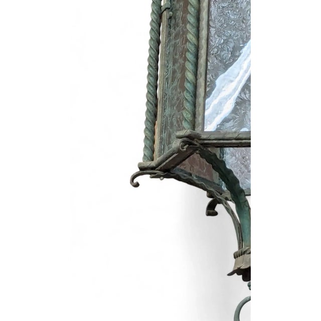 Vintage Spanish Revival exterior bronze pendant light with glue chipped glass. Acanthus leaves adorn the shade and the...