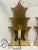 Cut out gold leaf background pagoda sconces. Wired for wall installation. and have a melted candle look for light bulb.