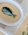A cheerful little fish painting, hand-painted by master artists using acrylic paints and natural pigments. He is full of...