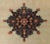 The vibrant central medallion on plain beige background with symmetric corners. Floral decorated border. Wool pile on...