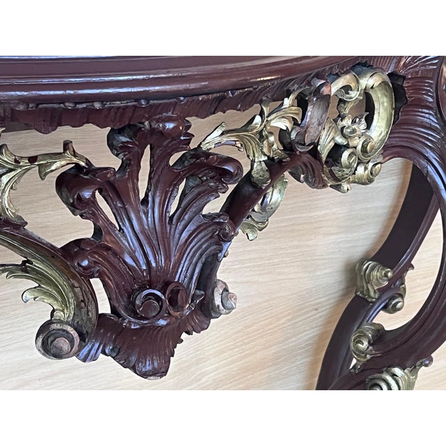 20th French Regency carved walnut console table with gilted edges 20th century French Regence style beautifully carved...