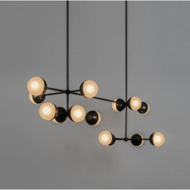 Molecule linear chandelier by Schwung Dimensions: D 149.6 x H 183.8 cm Materials: Brass, opal glass Weight: 14.2 kg...