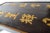 Unusual Black ebonised Gilt Wood Coffee Table With Chinese Calligraphy and Ming Feet. This coffee table has gilt...