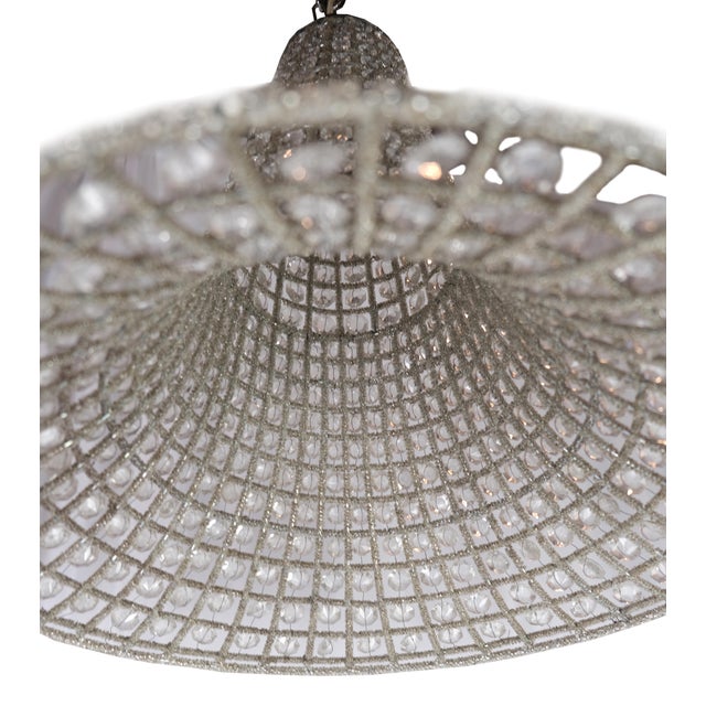 French bell shaped beaded glass and wire pendant chandeliers. We found these chic pendant lights in Paris. They are a...