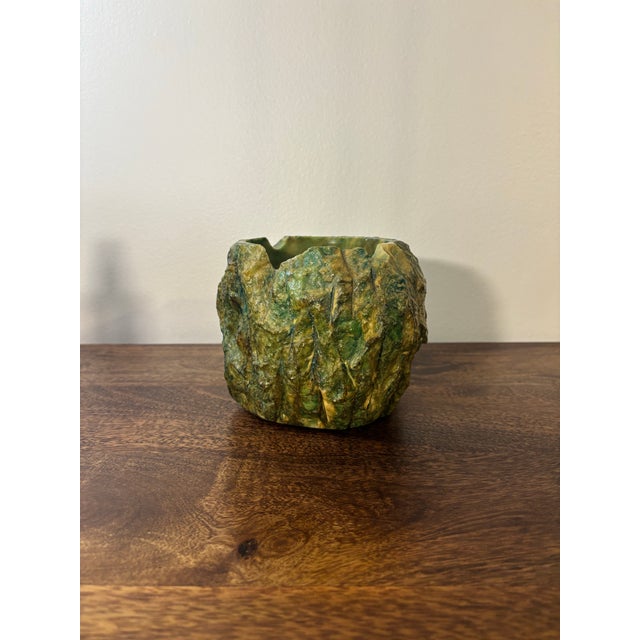 Substantial and architectural, this green alabaster ashtray from Volterra, Italy features a dramatic raw exterior...