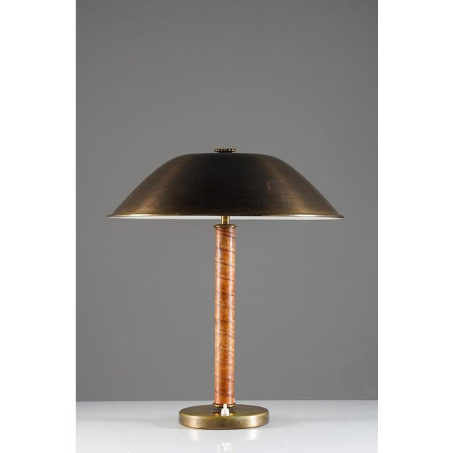 Elegant table lamp designed by bertil brisborg for nordiska kompaniet, model 30595. The lamp features a wide, gently domed...