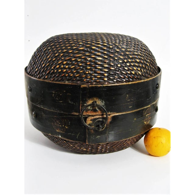Uncommon Chinese wedding/food basket from the mid 19th century. Original iron hardware intact. Woven rattan and wood with...