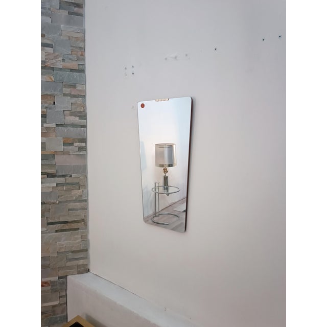 Magnificent trapezoidal mirror by Fratelli Fanzago. Italy, 1960s. An extremely rare piece from this Italian workshop,...