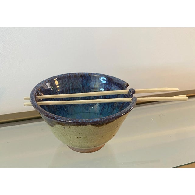 Vintage hand-made ceramic bowl with chopstick holder - chopsticks not included. Stoneware on the outside, midnight blue on...