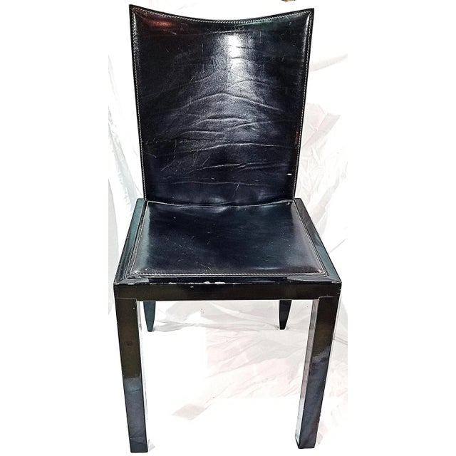 Simple yet still elegant black leather modern 1970s side or desk chair with sprung reclining back, sturdy gloss wood frame...