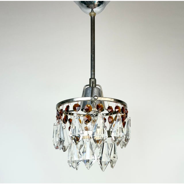 This listing is for a set of two matching vintage pendant lights, beautifully decorated with clear crystal prisms and...