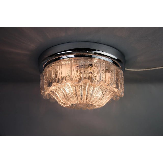 This ceiling lamp was produced by Limburg, circa 1970. The lamp is nickel plated and retains the original glass. Labeled...