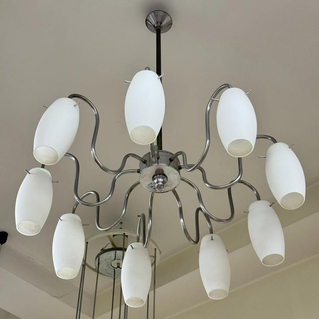 This impressive and spectacular modernist pendant lamp dates back to the 1970s, a perfect example of the spatial and...