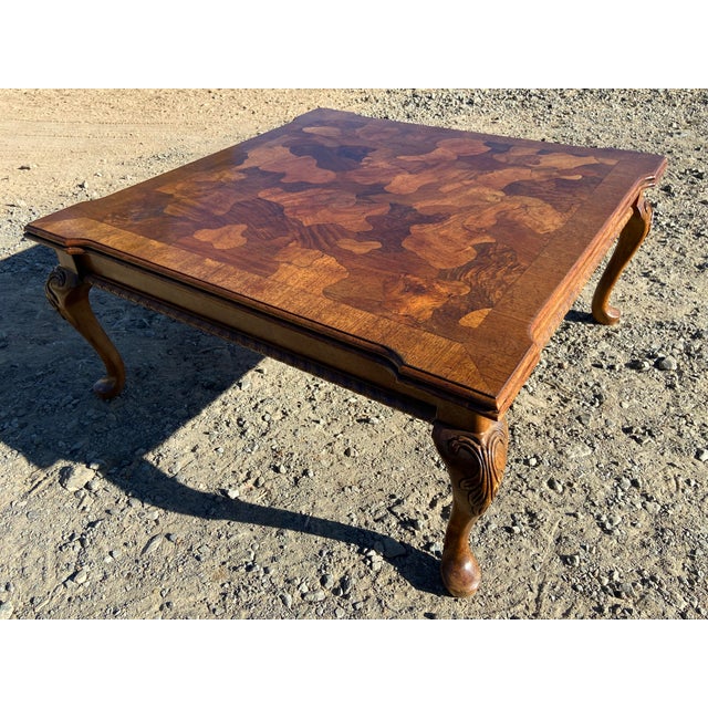 This Vintage Mid Century Modern French Provincial Parquetry Burl wood Coffee Table features a unique patchwork pattern and...