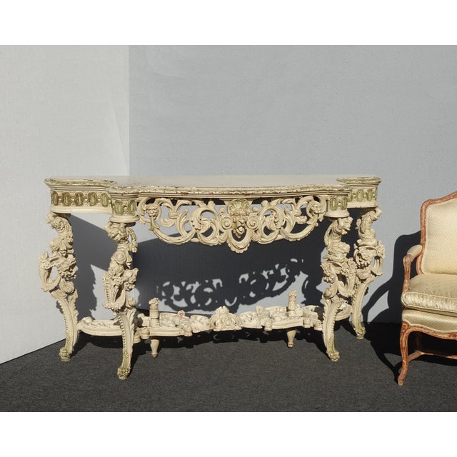 Gorgeous Console Table in Good Antique Condition. Solid and Firm. The paint has many chips but this only adds to its...