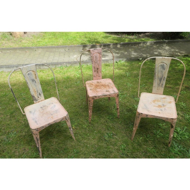 Set of 3 Tolix-style bistro or garden chairs dating from the early 20th century, full of character, beautifully patinated,...