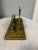 A delightful vintage English brass and repoussé letter rack, full of charm and character. The foreground and front stay...