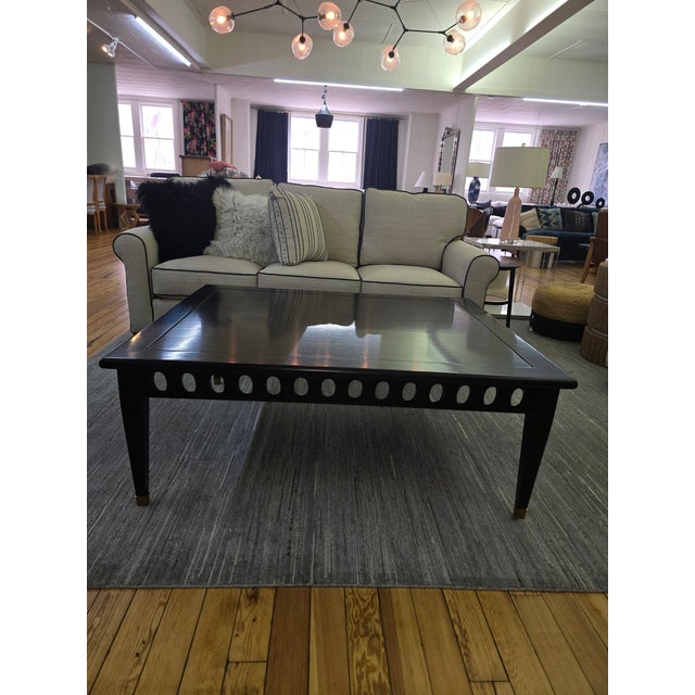 Contemporary Kravet cocktail table featuring a sleek rectangular silhouette with decorative cutout apron detailing and...