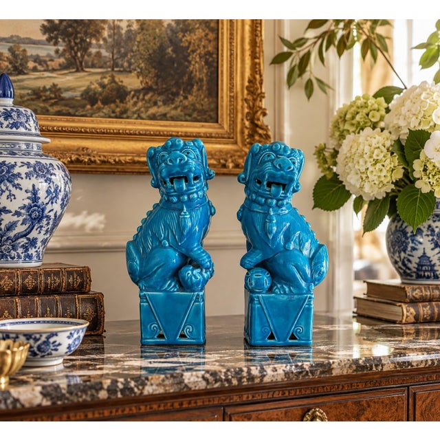 A wonderfully expressive pair of vintage porcelain guardian lions, or foo dogs, dating to circa 1960s Japan. Each is...