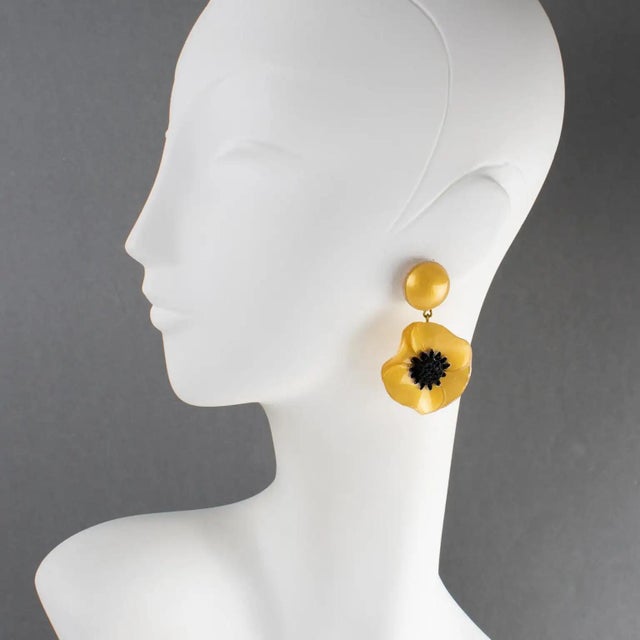 Cilea Paris designed these stunning, dimensional, dangling clip-on earrings. These oversized floral-inspired artisanal...