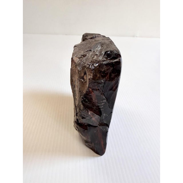 Unique sculpture, I could not find another like it. Weighs about 6.8 pounds.