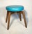 Vintage Mid Century Modern vanity sitting stool, newly reupholstered in teal/blue vinyl. This fabulous stool features a...