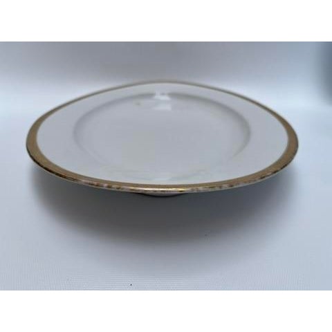 A single antique oval porcelain serving platter with gold greek key style border by O&EG Royal Austria.